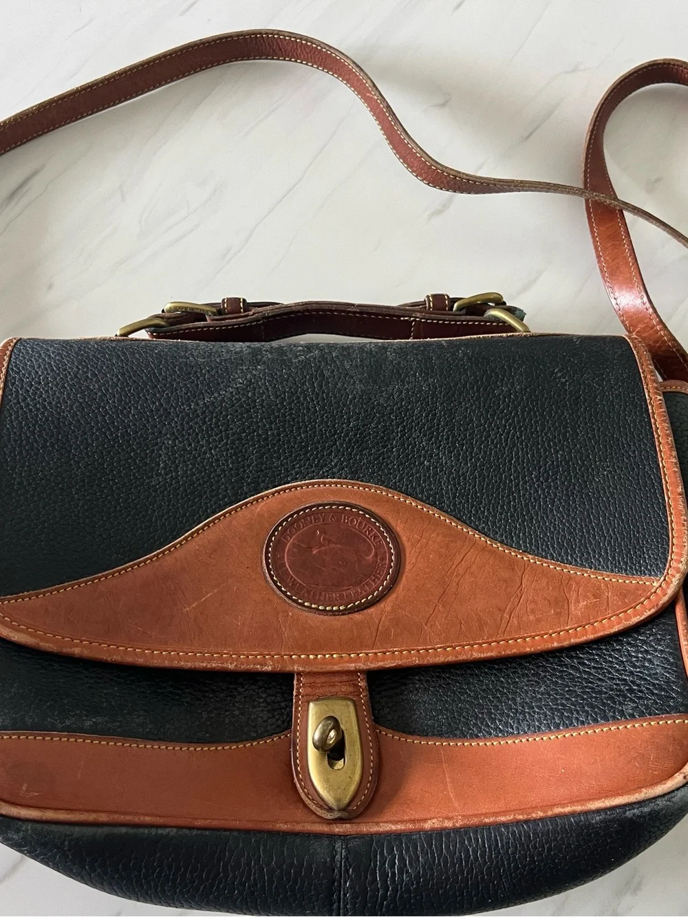 Dooney & Bourke Black and Brown Leather Satchel with Brass Turn Lock